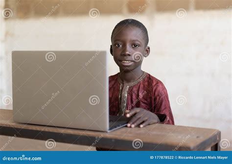 Little African Business Boy Studying In His School Desk Stock Photo