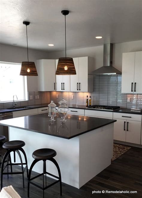 White cabinets and countertop, wood floors, gray cabinets (on the island) and multicolored backsplash. Remodelaholic | Grey and White Kitchen Cabinet Ideas