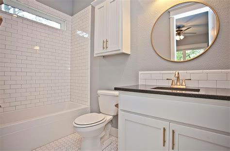 If you like an ocean effect use some of our blues in a bathroom such as. Guest bathroom with white subway tile backsplash, black ...