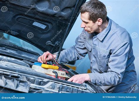 Auto Electrician Mechanic At Work With Car Stock Photo Image Of Test