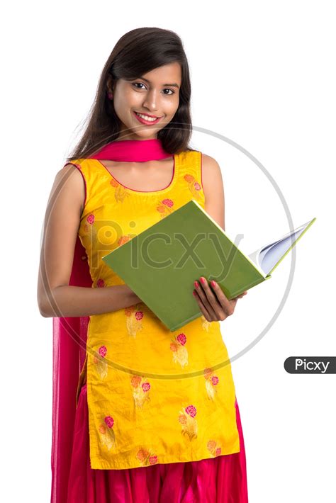 Image Of Beautiful Indian College Girl With A Open Book In Hand