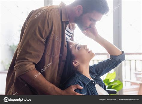 Side View Young Man Bending Seductive Woman Touching His Face Stock