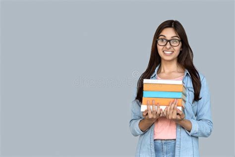 Young Adult Indian Student Girl Holding Books In Hands Stock Image