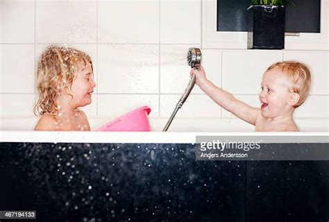 Two Girls Taking Shower Together Photos And Premium High Res Pictures