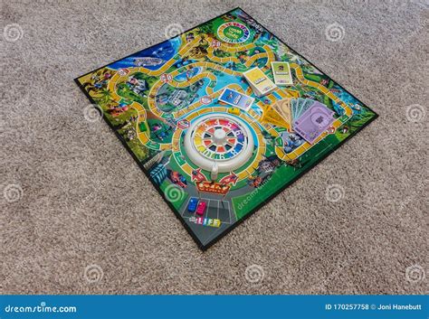 Game Of Life By Hasbro With All Of The Game Pieces On The Board