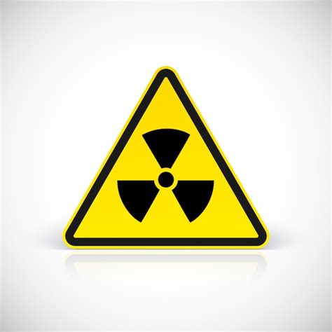 Sinais de perigo de radiação símbolo em sinal triangular Vetor Premium