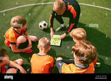 Football Training Soccer Coach Explaining Game Rules And Strategy