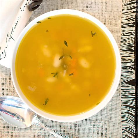 Savoring Time In The Kitchen Bean And Fresh Herb Soup With Cheddar
