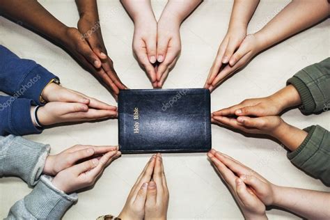 Praying Hands Pointing To A Bible Stock Photo By ©designpicsinc 31940329