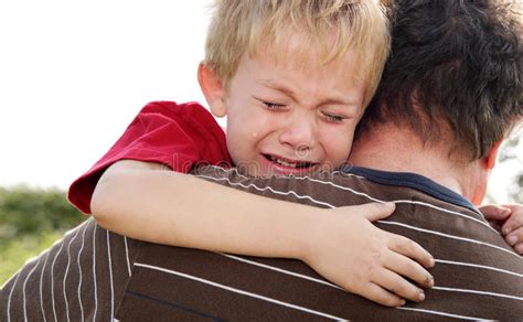 Crying Boy Being Comforted By His Father Stock Photo Image Of Hurt