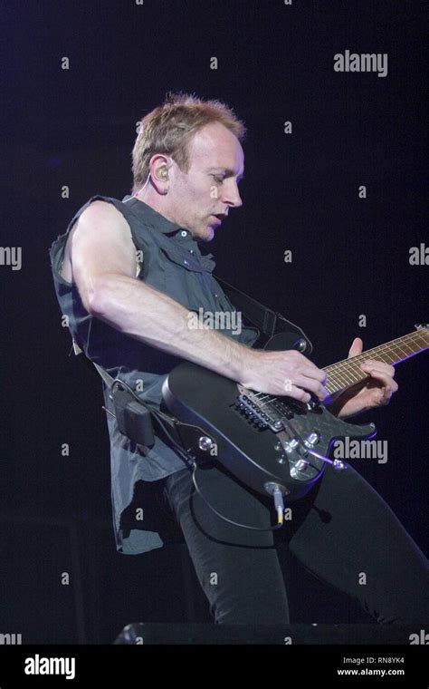 Def Leppard Guitarist Phil Collen Is Shown Performing On Stage During A