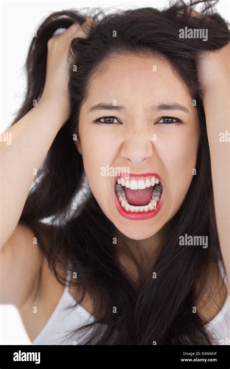 Woman Screaming And Pulling Her Hair Out Stock Photo Alamy