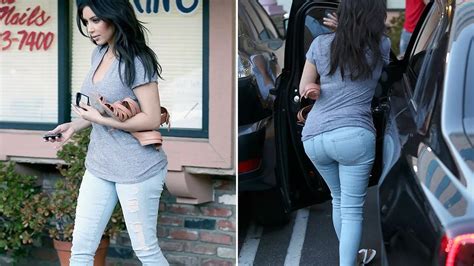 kim kardashian flaunts bum in skintight jeans and gets her nails done with sister khloe mirror