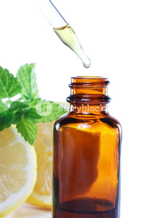Herbal Medicine Dropper Bottle With Mint Leaves And Lemon Royalty Free