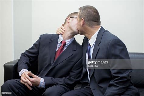 Two Men In Business Suits Kissing Photo Getty Images