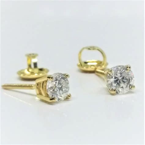 14k Yellow Gold Diamond Stud Earrings With A Total Weight Of 0 65 Ct