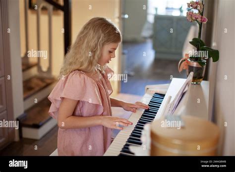 Beautiful Pianist Curly Blond Girl Play Piano At Cosy Home Caucasian