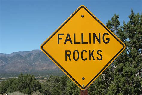 Falling Rock Sign Pictures Images And Stock Photos Istock