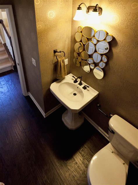 Small Powder Room With Pebble Mirror And Graphic Wallpaper Hgtv