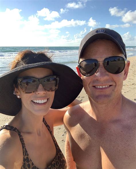 Download Luke Donald With His Wife Enjoying A Beach Vacation Wallpaper