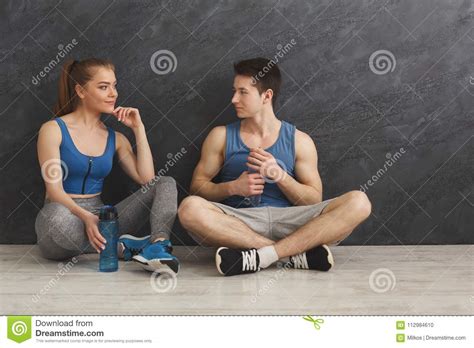 Fitness Couple Drinking Water At Gym Stock Photo Image