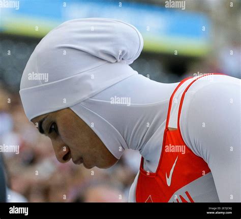 Rakia Al Gassra Of Bahrain Looks Down After Crossing The Finish Line In