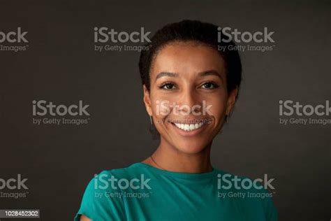 Studio Portrait Of A 30 Year Old Woman On A Black Background Stock