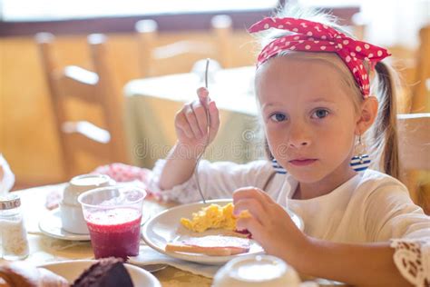 Adorable Little Girl Having Breakfast At Stock Photo Image Of Funny