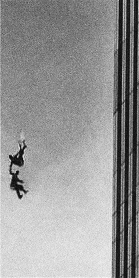 Two People Holding Hands As They Fall From The Twin Towers