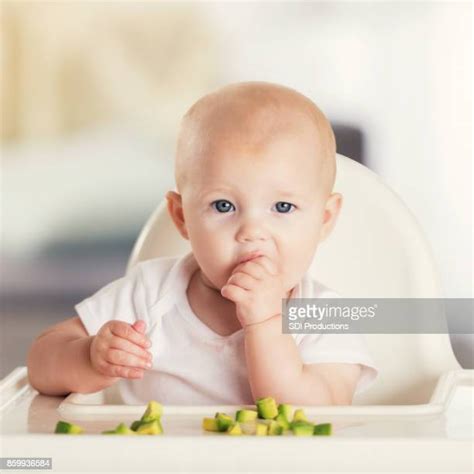 Baby Feeding Herself Photos And Premium High Res Pictures Getty Images