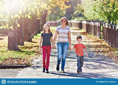 Mother With Children Walking In Autumn Park Stock Image Image Of