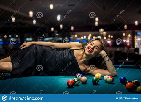 Girl Lies On The Snooker Table Among The Balls Stock Photo Image Of