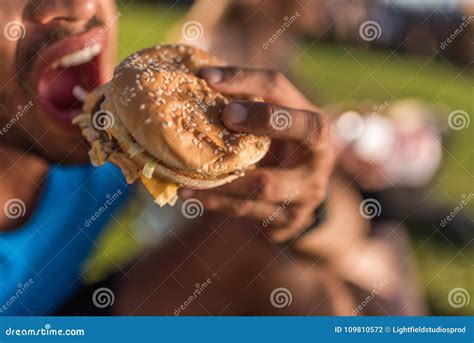 Man Biting Hamburger Stock Photo Image Of Partial Biting 109810572
