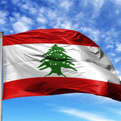 National Flag Of Lebanon On A Flagpole In Front Of Blue Sky Cedar Routes