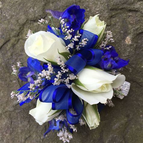 White Spray Rose With Royal Blue Prom Corsage Done By Guignard Florist