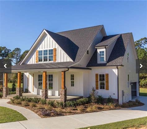 White Farmhouse Exterior With Stone