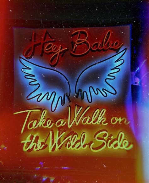 A Neon Sign That Says Hey Balde Take A Walk On The Wild Side With Wings