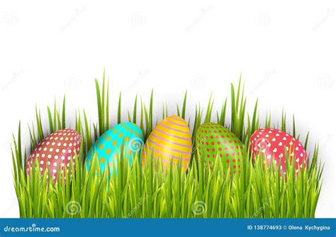 Row Of Easter Painted Eggs Hidden In Green Grass And Isolated On White