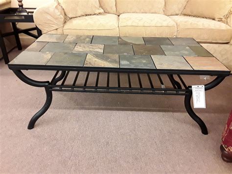 This ashley leather ottoman infuses loads rustic yet contemporary allure for your space as a footrest, extra seating, or even as a coffee table when you place a tray on top. ASHLEY TILE TOP COFFEE TABLE | Delmarva Furniture Consignment
