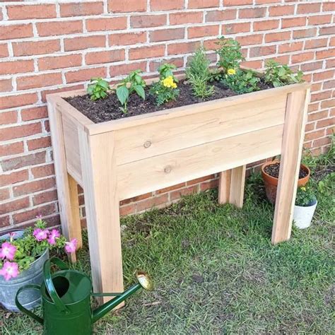 Three 8 foot long 2×6 pine boards; How to Build a Raised Garden Bed with Legs | Elevated ...