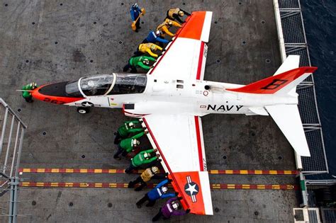 Here Is What All Those Colored Shirts Mean On An Aircraft Carrier's Deck