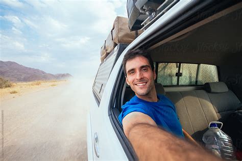 Young Happy Man Taking A Selfie From The Passenger Seat Open Window With Views Of The Dusty