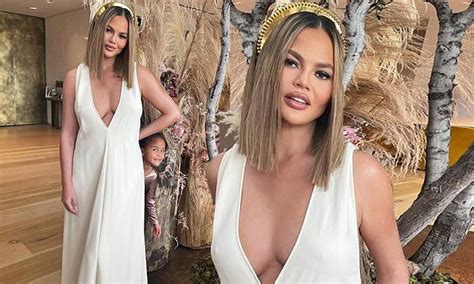 Chrissy Teigen Puts On A Busty Display In A Plunging White Dress