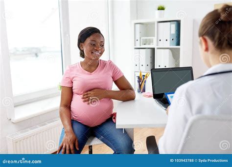 Gynecologist And Happy Pregnant Woman At Hospital Stock Photo Image