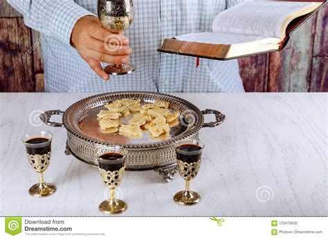 Holy Communion On Wooden Table In Church Cup Of Glass With Red Wine
