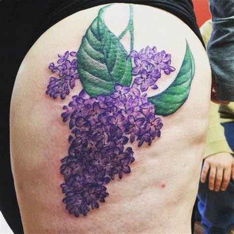 A Womans Thigh With Purple Flowers On It