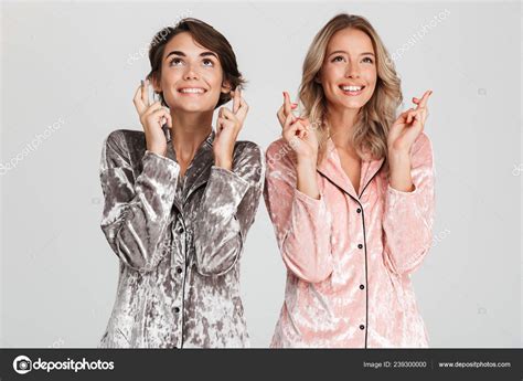 Two Cheerful Girls Wearing Pajamas Standing Isolated Gray Background