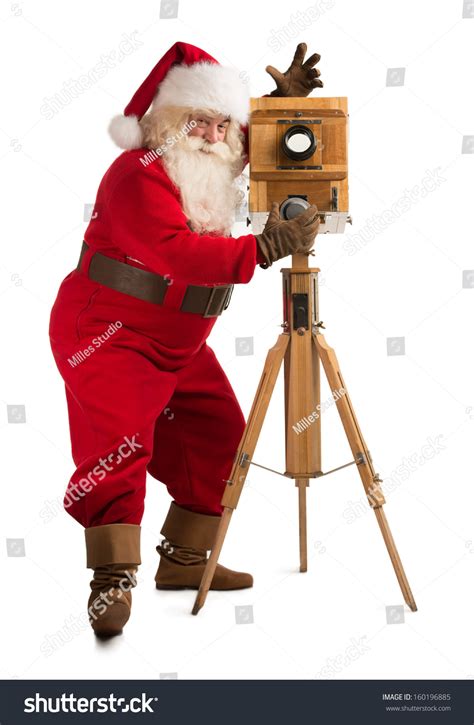 Santa Claus Taking Picture With Old Wooden Camera Full Length Portrait