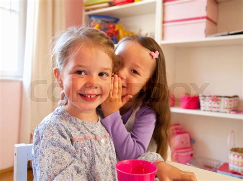 Girls Whispering To Each Other Stock Image Colourbox