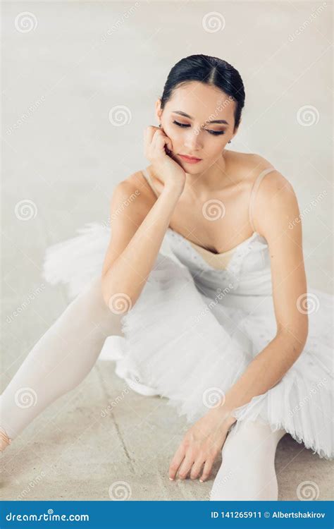 Delighted And Serious Ballerina Sitting On The Floor Stock Image Image Of Elegant Daylight